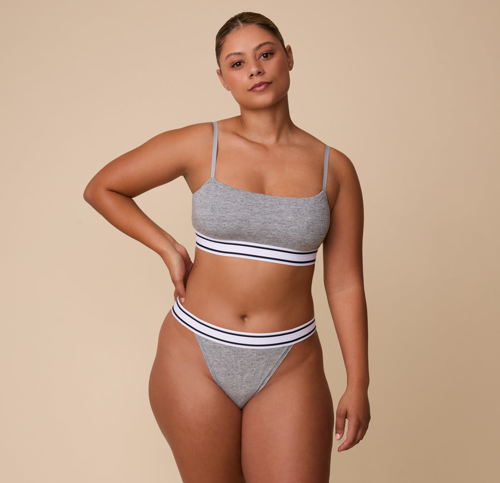India stands confidently in the Cloud Cotton Retro Bandeau Bralette in Heather Charcoal, paired with the matching Cloud Cotton French Cut Brief, showcasing the comfortable, body-hugging fit.