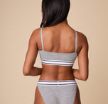 Back view of Ally in the Cloud Cotton Retro Bandeau Bralette in Heather Charcoal, showcasing the adjustable straps and snug underband.