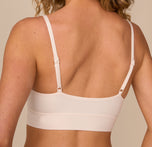 Close-up back view of model Freya in the Cloud Cotton Thin Strap Bralette in Quartz. The image highlights the clean finish and adjustable thin straps for all-day wearability.