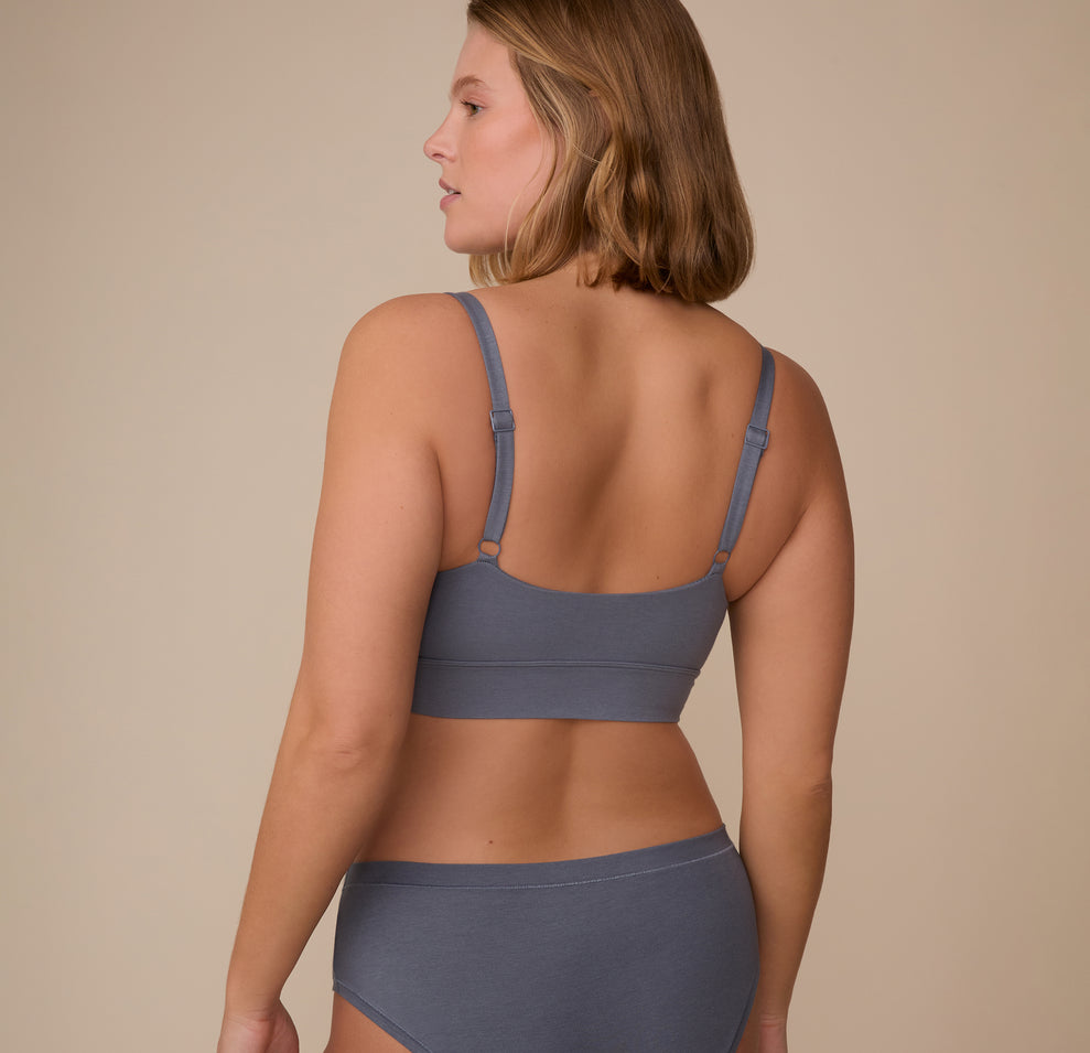 Back view of Sonnie in the Cloud Cotton Thin Strap Bralette in Slate, with minimal seams and adjustable straps that rest flat against the skin.