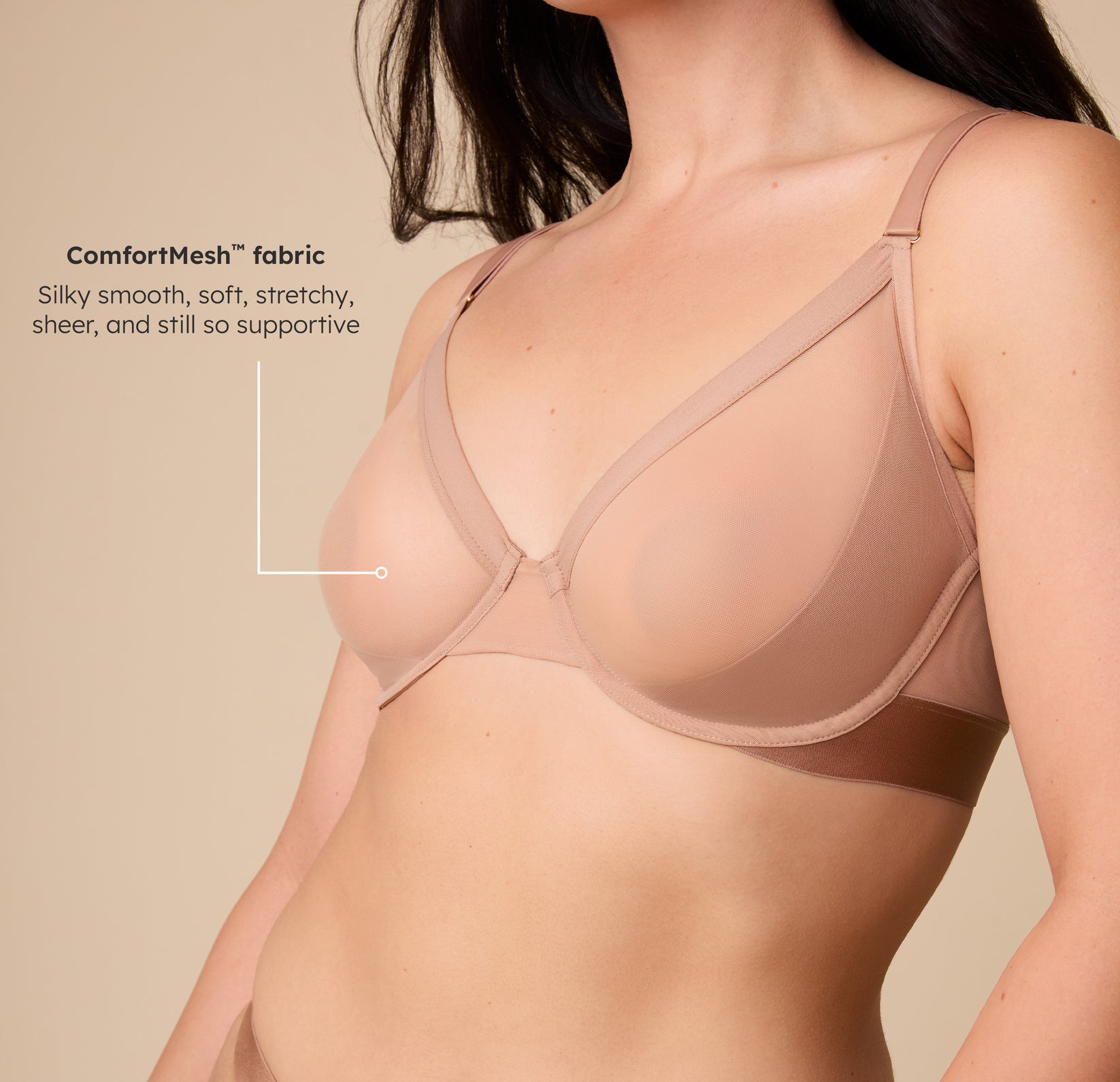 Close-up angled view of Emersyn in the ComfortMesh Plunge Bra in Taupe, highlighting the sheer fabric and underwire support. The tagline reads, "“ComfortMesh Fabric: silky smooth, soft, stretchy, sheer, and still so supportive”.