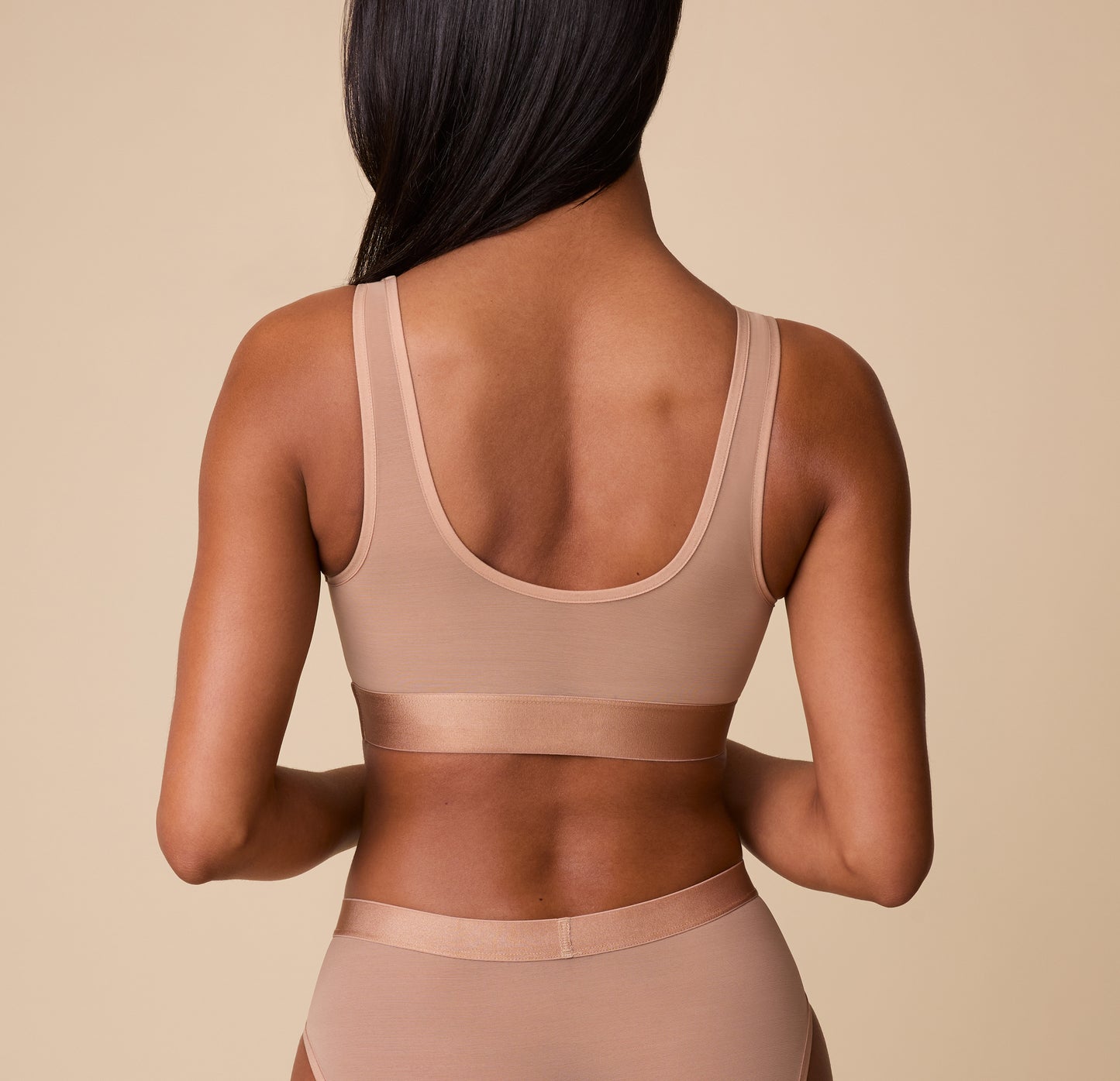 Back view of the ComfortMesh™ Scoop Bralette in Taupe. The scoop-back design emphasizes the soft, stretchable band and breathable material.