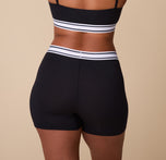 Back view of India in the Cloud Cotton Retro Boxer Brief in Black, highlighting the high-rise waistband and full back coverage.