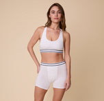 Full-body shot of Gracie in the Cloud Cotton Retro Boxer Brief in White – She pairs the boxer brief with the matching Cloud Cotton Retro Racerback Bralette, standing confidently against a neutral background.