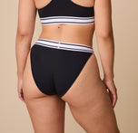 Back view of model Emersyn in the Harper Wilde Cloud Cotton Retro French Cut Bikini in Black. The high-rise bikini accentuates curves while offering a smooth and comfortable fit.