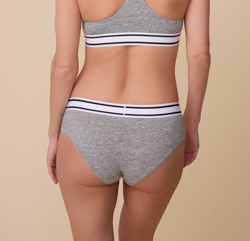Back view of Gracie in the Cloud Cotton Retro Hiphugger in Heather Charcoal. The full-coverage fit highlights the smooth, breathable cotton fabric and the comfortable stretch waistband.