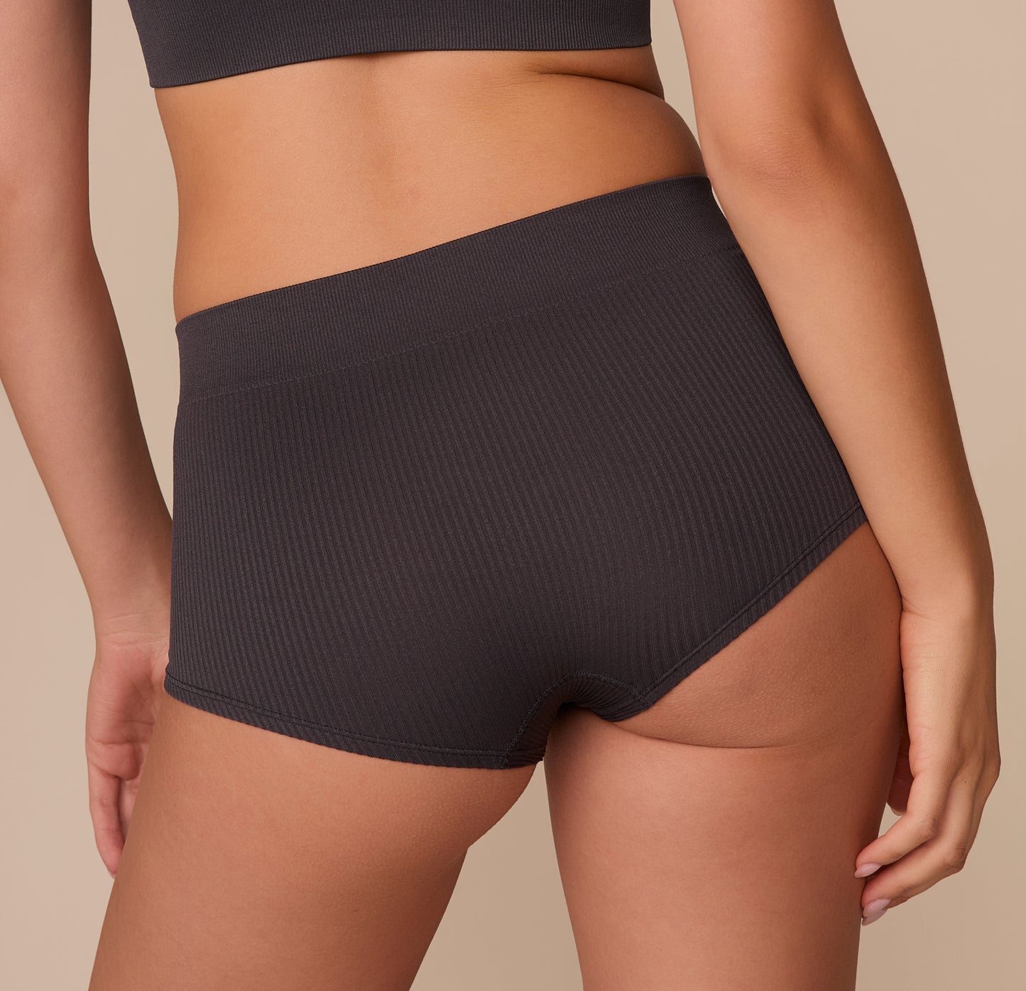 Rear close-up of the Lounge Rib Boyshort, focusing on the clean stitching and soft, flexible fit around the hips and thighs, designed for lounging or everyday wear.