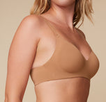 Close-up side view of Megan wearing the Base Wirefree T-Shirt Bra in Tan, focusing on the molded cups and comfortable design for everyday comfort.