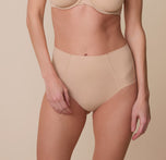 A close-up of Gracie wearing the No-Show Highwaist Brief in Beige. The smooth, seamless design and high-waisted fit provide a sleek look. sizing: Gracie wears size Small