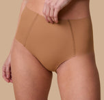 A close-up of the No-Show Highwaist Brief in Tan, showcasing the raw-edge finish and lightweight, barely-there feel.
