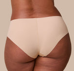 A close-up back angle of the No-Show Hiphugger in Beige, showcasing the raw-edge finish and lightweight, smoothing fabric from the back.