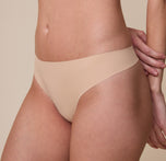 A closer view of the No-Show Thong in Beige, emphasizing the laser-cut edges and smooth, seamless fit for a second-skin feel.