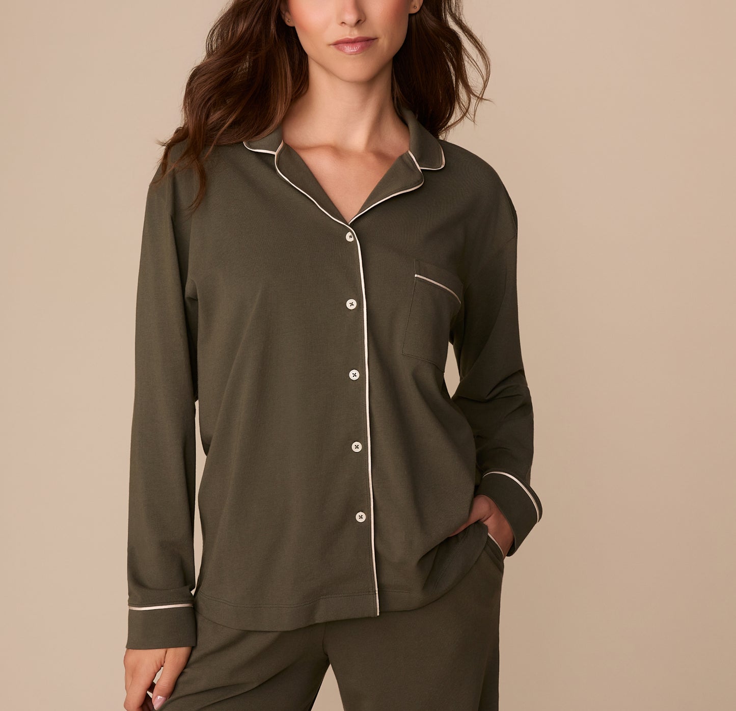 Front view of model Alexis wearing the Perfect Pima Long Sleeve Pajama Shirt and Pants in Olive. The shirt features a button-down front, chest pocket, and white contrast piping. sizing: Alexis wears size Small