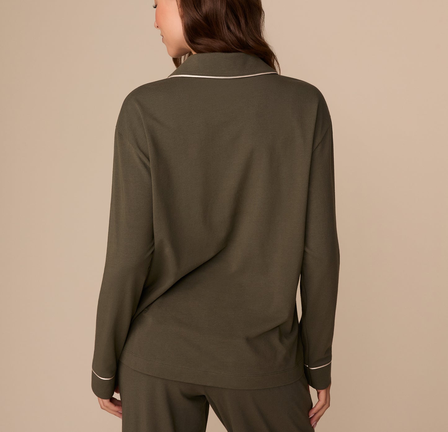 Back view of Alexis in the Perfect Pima Long Sleeve Pajama Shirt in Olive. The image shows the relaxed fit and smooth finish of the fabric.
