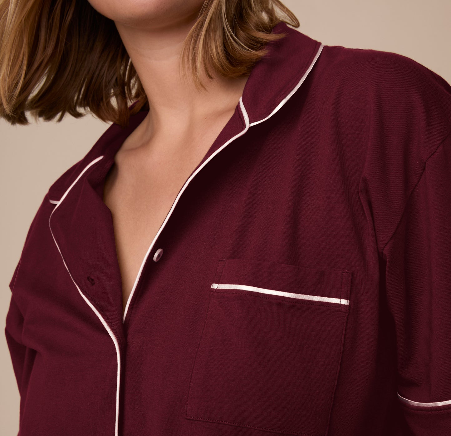 Close-up of the collar and chest pocket on the Perfect Pima Pajama Shirt in Bordeaux. The white piping details are visible against the deep red fabric.