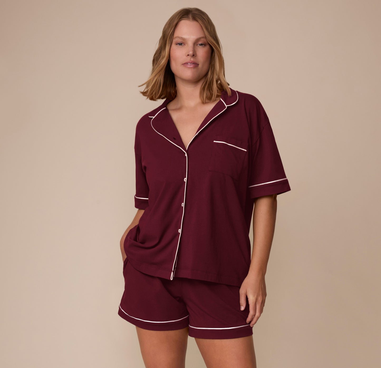 Full front view of model Sonnie in the Perfect Pima Pajama Shirt and Shorts set in Bordeaux. The image showcases the complete matching set.