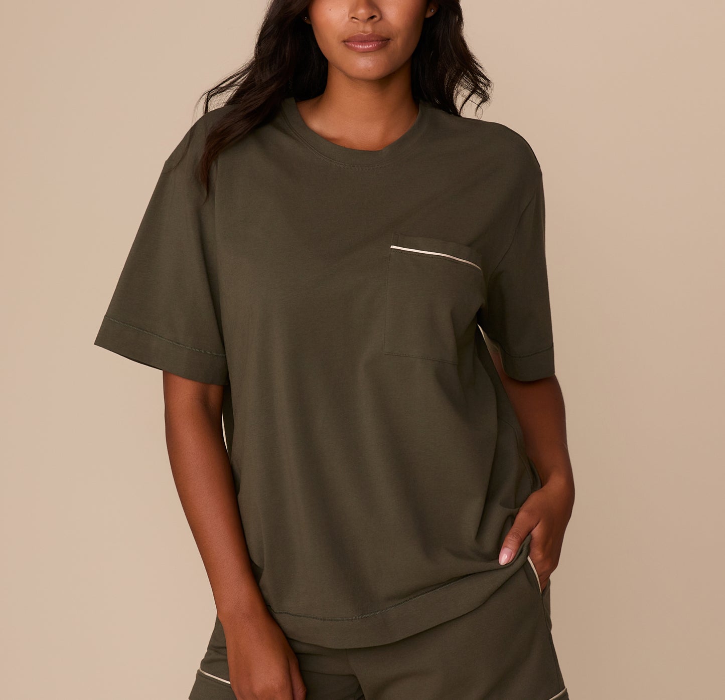 Front view of model Victoria wearing the Perfect Pima Pajama Tee and Shorts in Olive. The short-sleeve tee features a relaxed fit and a chest pocket trimmed with white piping. sizing: Victoria wears size Medium