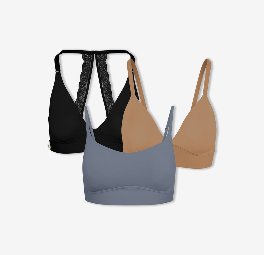 A trio of Harper Wilde Bliss Lace Halterneck Bralette in Black, Bliss Triangle Bralette in Tan, and Bliss Scoop Bralette in Steel — offering wireless support and comfort.