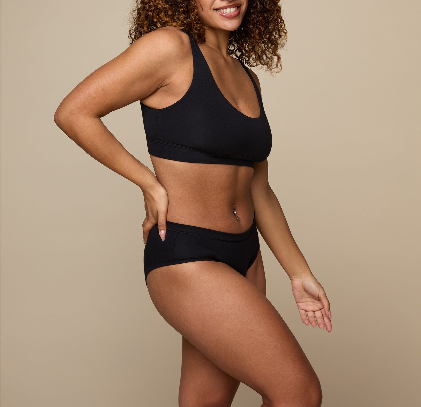 Woman wearing the Cloud Cotton Hiphugger underwear in the color Black