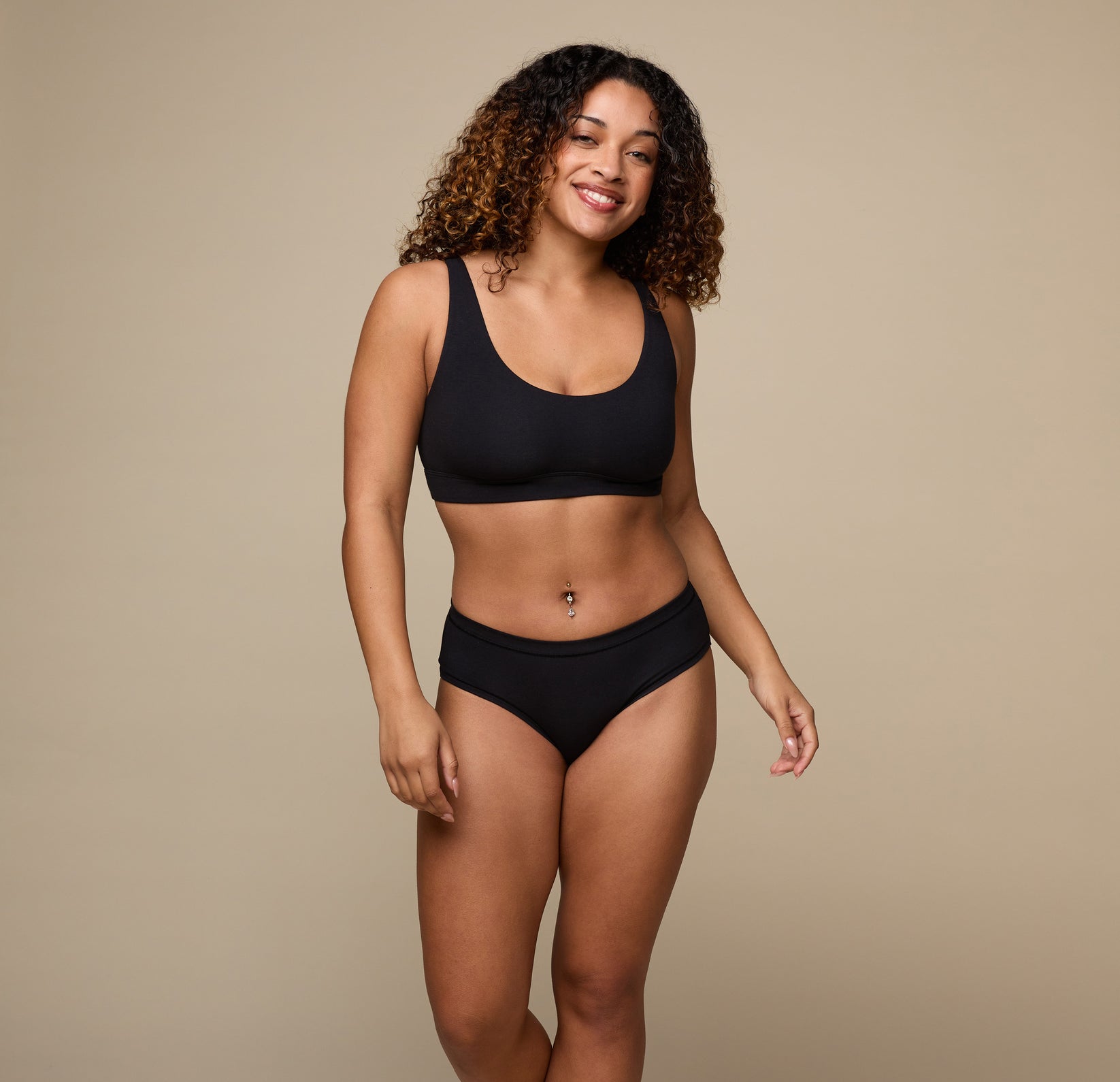 Woman wearing the Cloud Cotton Hiphugger underwear in the color Black