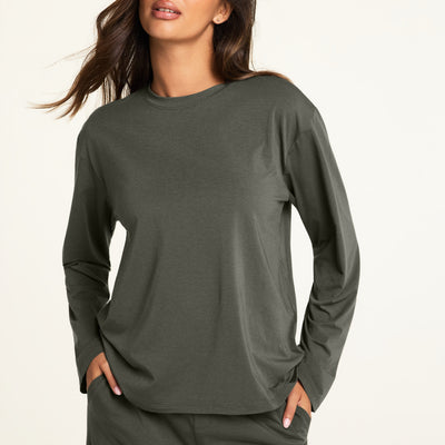 Hero close-up of the Cloud Cotton Long Sleeve T-Shirt in Olive, a relaxed crew-neck long sleeve tee in cloud-soft cotton-modal fabric, paired with the Cloud Cotton Pant in Olive.
