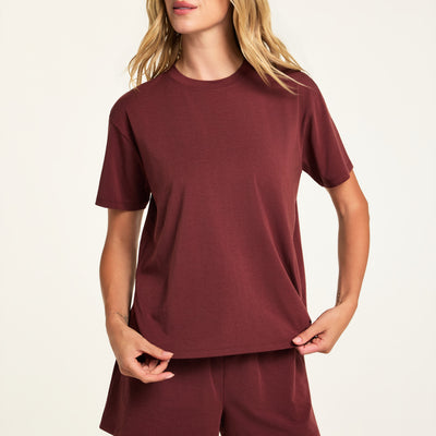 Hero close-up of the Cloud Cotton T-Shirt in Cabernet, a relaxed crew-neck short sleeve tee in cloud-soft cotton-modal fabric, paired with the Cloud Cotton Short in Cabernet.