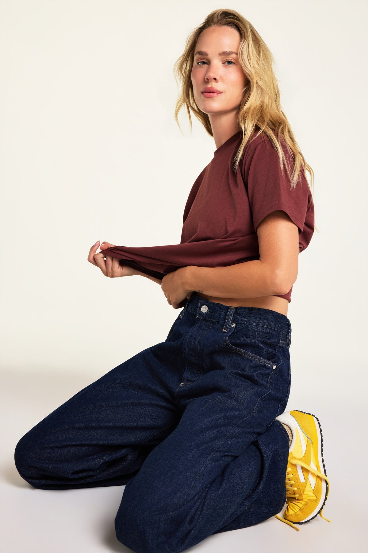Editorial on-model shot of the Cloud Cotton T-Shirt in Cabernet styled with the Cloud Cotton Short in Cabernet.
