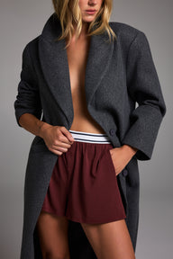 Editorial on-model shot of the Cloud Cotton T-Shirt in Cabernet styled with the Cloud Cotton Short in Cabernet.