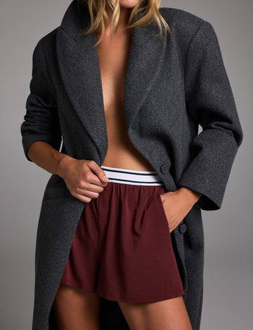 Editorial on-model shot of the Cloud Cotton T-Shirt in Cabernet styled with the Cloud Cotton Short in Cabernet.
