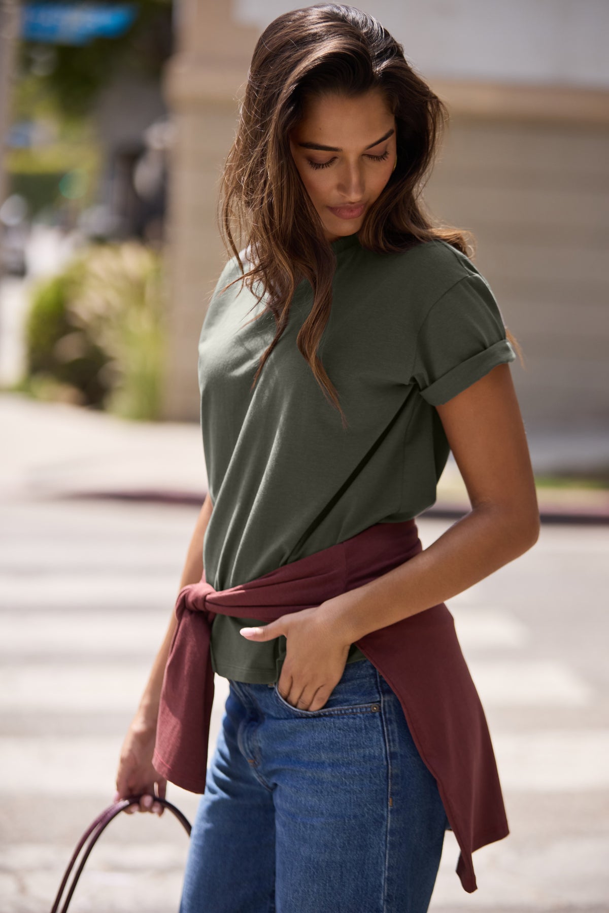 Lifestyle on-model shot of the Cloud Cotton T-Shirt in Olive.