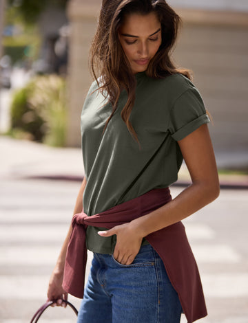 Lifestyle on-model shot of the Cloud Cotton T-Shirt in Olive.