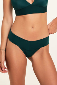 Front on-model shot of the Bliss Low Rise Thong in Pine paired with the Bliss Triangle Bralette in Pine.