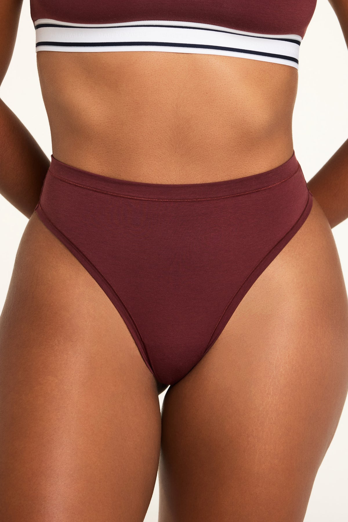 Front on-model shot of the Cloud Cotton Highwaist Thong in Cabernet paired with the Cloud Cotton Bandeau Bralette in Cabernet.
