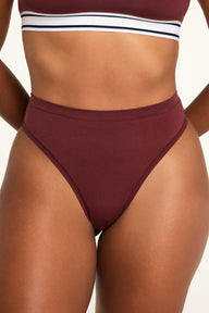 Front on-model shot of the Cloud Cotton Highwaist Thong in Cabernet paired with the Cloud Cotton Bandeau Bralette in Cabernet.