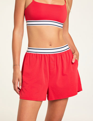 Front on-model shot of the Cloud Cotton Short in Cherry paired with the Cloud Cotton Bandeau Bralette in Cherry.