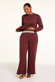 Front on-model shot of the Cloud Cotton Pant in Cabernet paired with the Cloud Cotton Long Sleeve T-Shirt in Cabernet.