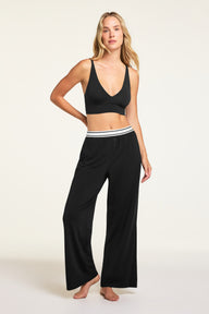 Front on-model shot of the Cloud Cotton Pant in Black paired with the Cloud Cotton Long Sleeve T-Shirt in Black.