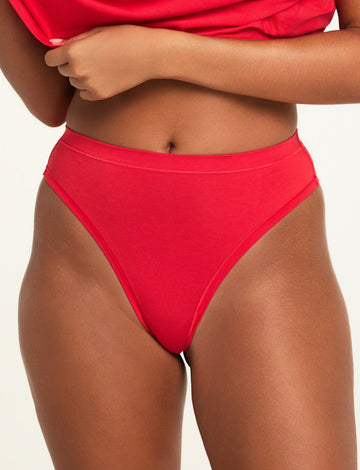 Front on-model shot of the Cloud Cotton Highwaist Thong in Cherry paired with the Cloud Cotton T-Shirt in Cherry. sizing: Kushi wears size Small