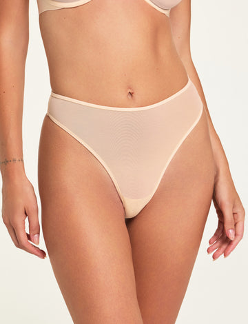 Front on-model shot of the ComfortMesh™ Thong in Pearl paired with the ComfortMesh™ Plunge Bra in Pearl. sizing: Holly wears size Small 