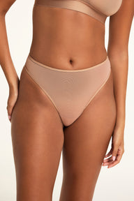 Front on-model shot of the ComfortMesh™ Thong in Taupe paired with the ComfortMesh™ Triangle Bralette in Taupe.