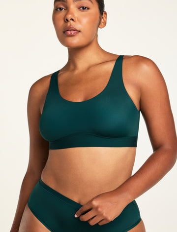 Front on-model shot of the Bliss Scoop Bralette in Pine paired with the Bliss French Cut Brief in Pine. sizing: Amber wears size Medium