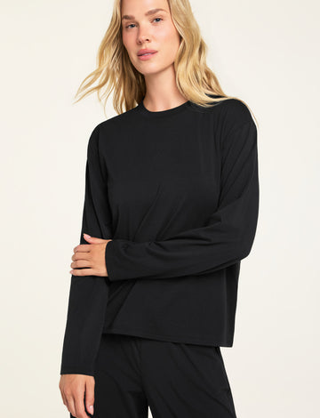 Front on-model shot of the Cloud Cotton Long Sleeve T-Shirt in Black paired with the Cloud Cotton Pant in Black.