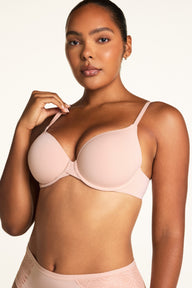 Front view of the Base T-Shirt Bra in Ember Rose on model, showing the smooth molded cups and clean neckline. sizing: Amber wears size 34D
