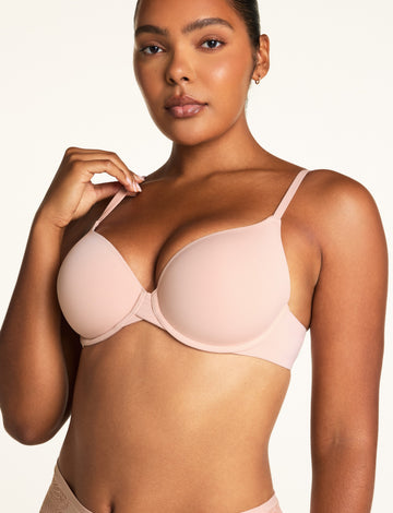 Front view of the Base T-Shirt Bra in Ember Rose on model, showing the smooth molded cups and clean neckline. sizing: Amber wears size 34D
