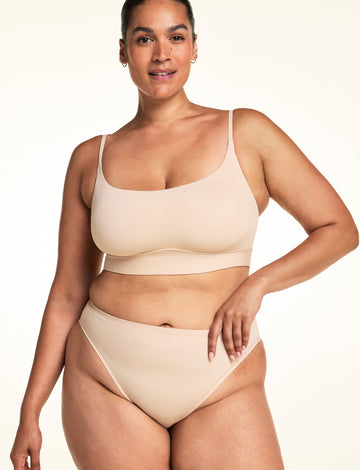 Full-length front view of the Bliss Thin-Strap Scoop Bralette in Beige.