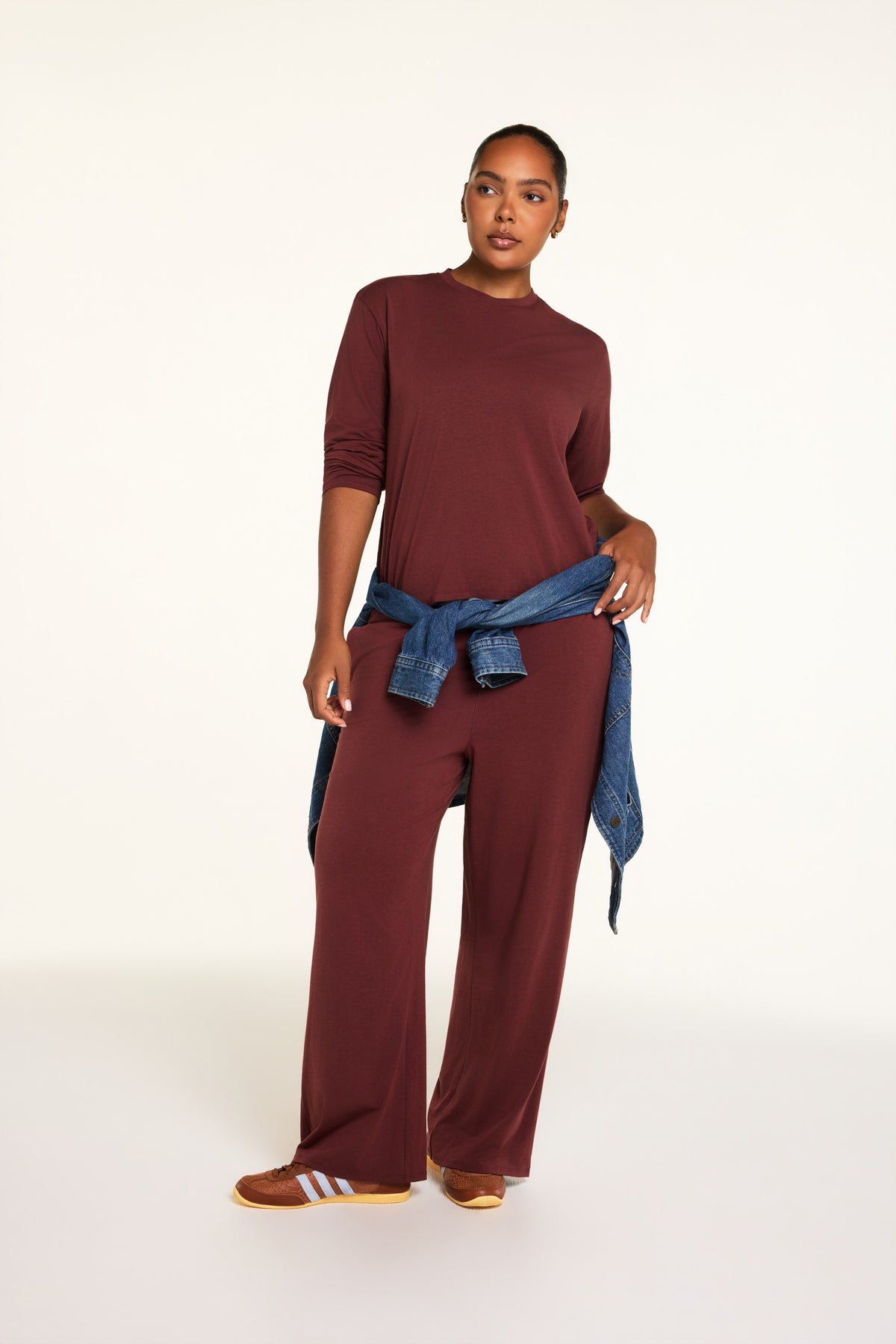 Editorial on-model shot of the Cloud Cotton Long Sleeve T-Shirt in Cabernet styled with the Cloud Cotton Pant in Cabernet.