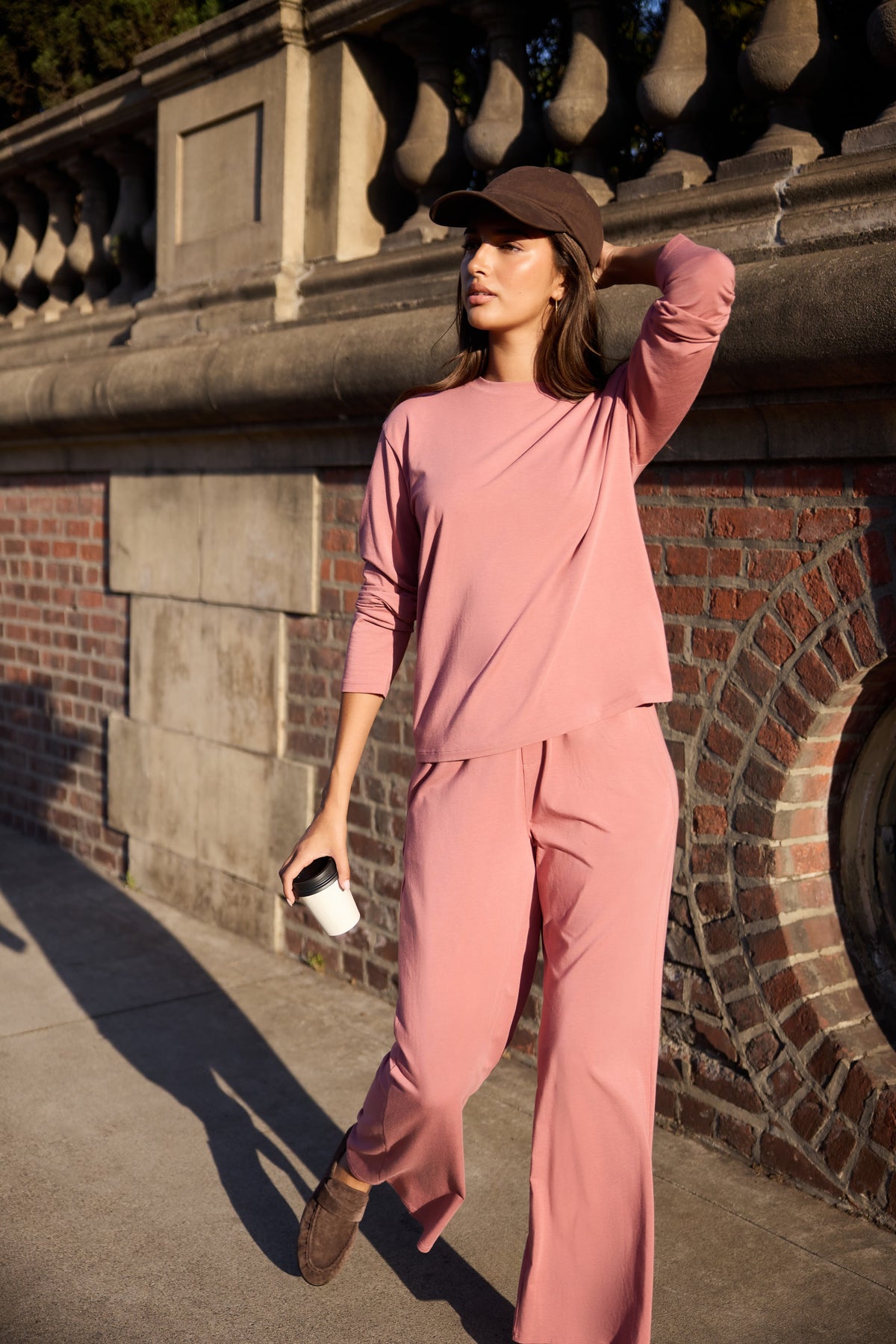Lifestyle on-model shot of the Cloud Cotton Long Sleeve T-Shirt in Winter Rose paired with the Cloud Cotton Pant in Winter Rose.