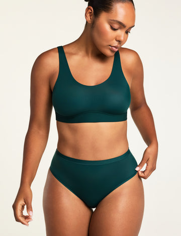 Three-quarter front view of the Bliss French Cut Brief in Pine paired with the Bliss Scoop Bralette in Pine.