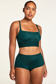 Three-quarter front view of the Bliss Boyshort in Pine paired with the Bliss Square Neck Bralette in Pine.