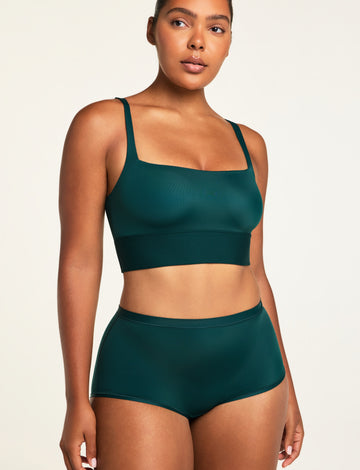 Three-quarter front view of the Bliss Boyshort in Pine paired with the Bliss Square Neck Bralette in Pine.